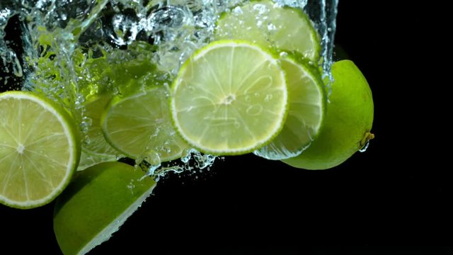 Super slow motion of falling lime pieces into splashing water. Filmed on high speed cinema camera, 1000 fps.