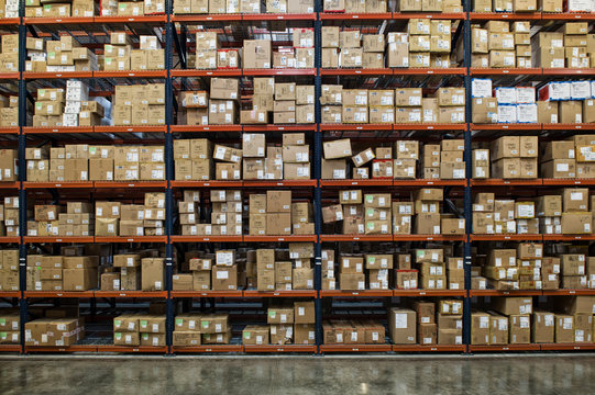 Racks of cardboard boxes in distribution warehouse