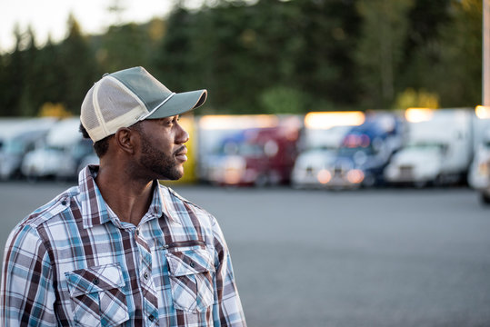 Truck driver standing at truck stop