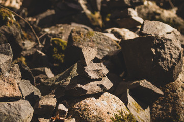 small stone turrets in the forest. stone sculptures