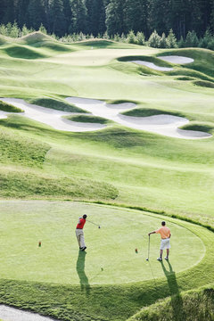 High angle view of golfers playing on golf course
