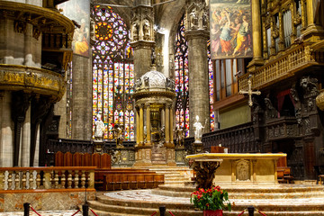 Milano, Italy. 2017/12/12. The altar with stained glass windows in the background. Duomo di Milano...