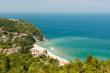 Turkey's Black Sea coast resort area bay among green gocks