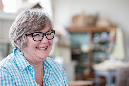 Portrait of smiling mature woman wearing eyeglasses