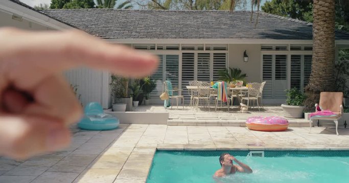 funny finger pushing man in swimming pool summertime fun outdoors 4k