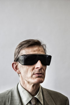 Close Up Of Man Wearing Safety Glasses