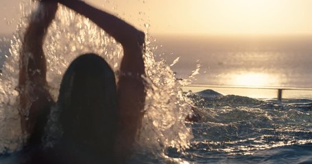 friends swimming in pool splashing playfully enjoying summer vacation having fun celebrating summertime holiday at luxury hotel with ocean view sunset 4k