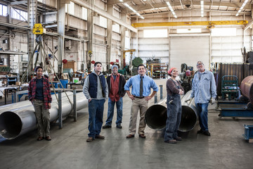 Workers standing in factory