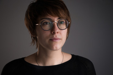 Fototapeta premium Portrait of girl with brown short hair looking ahead