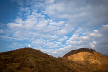 Landscape with white cross