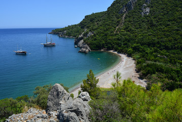 Fototapeta premium View from a rock to the sea and beach with ships