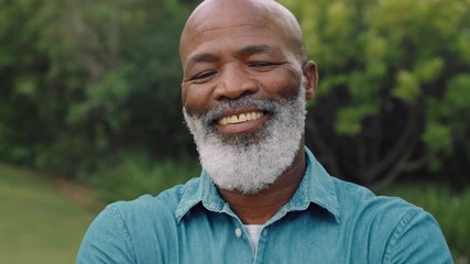 portrait old african american man smiling looking happy in park enjoying successful retirement lifestyle testimonial concept 4k