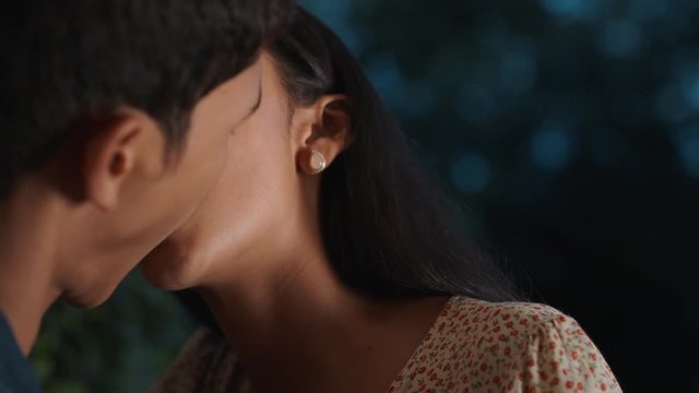 happy teen couple first kiss beautiful teenage girl kissing boyfriend outside home enjoying romantic evening date 4k footage