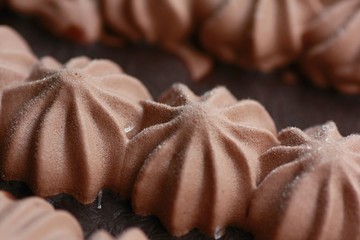 Close-up view of small scoops of chocolate ice cream. Chocolate frozen dessert.