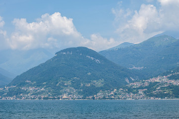 View of mountain lake on a sunny summer day. District of Como Lake, Colico, Italy, Europe