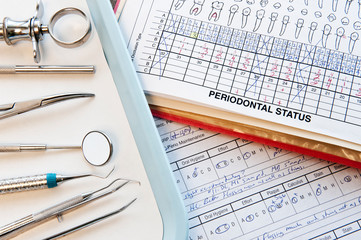 Close up of dental tools and records