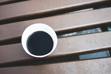 beverage hot coffee paper cup at wooden background. morning mood. lifestyle concept.