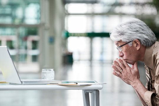 Thoughtful businessman sitting in office