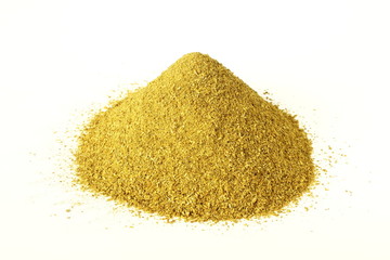 heap of coriander powder in white background top view