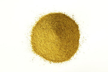 heap of coriander powder in white background top view