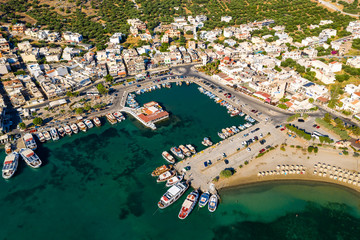 ELOUNDA, CRETE, GREECE - 13 JULY 2019: Aerial view of the up market town of Elounda on the greek island of Crete