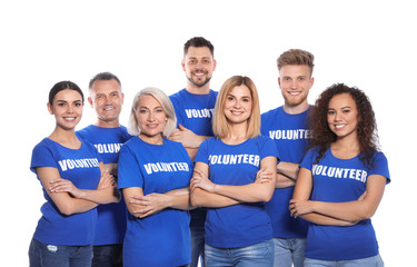 Team of volunteers in uniform on white background