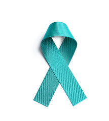Teal awareness ribbon on white background, top view. Symbol of social and medical issues