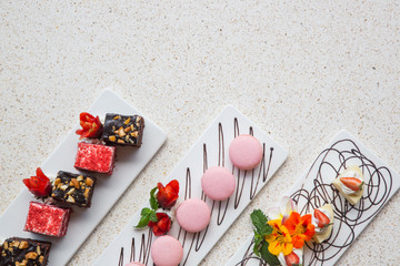 Different types of cookies arranged n long elegant trays