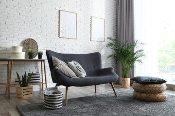 Stylish living room with modern furniture and stylish decor. Idea for interior design