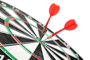 Dart board with color arrows hitting target, closeup