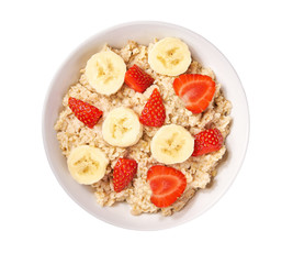Ceramic bowl of oatmeal porridge with banana and strawberry  isolated , hot and healthy food for breakfast, top view.