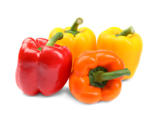 Fresh ripe bell peppers on white background