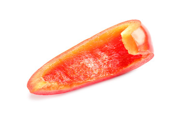 Slice of ripe red bell pepper on white background