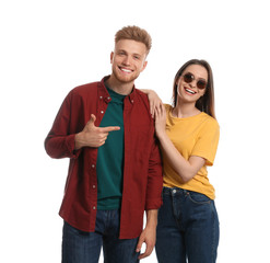 Young couple wearing blank t-shirts isolated on white. Mockup for design