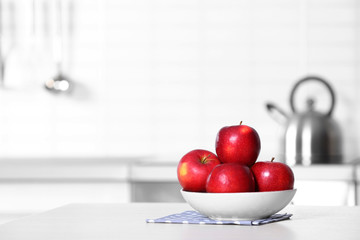 Bowl of fresh red apples on kitchen counter. Space for text