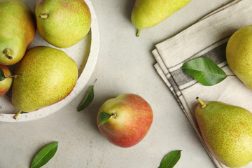 Ripe juicy pears on grey stone table, flat lay