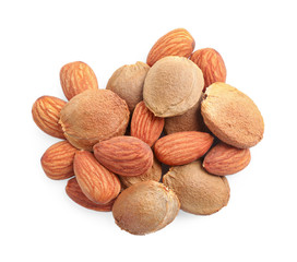 Organic dried apricot kernels on white background, top view
