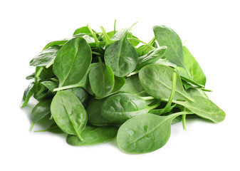 Pile of fresh green healthy baby spinach leaves on white background