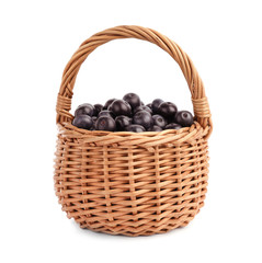 Fototapeta na wymiar Wicker basket with fresh acai berries on white background