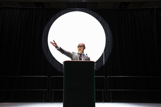 Businessman giving speech at convention center