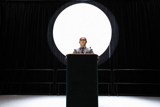 Businessman giving speech at convention center