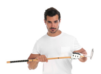 Young man posing with golf club on white background