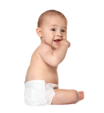 Cute little baby sitting on white background
