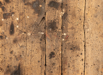 background in the form of vertical wooden old boards with a lot of burnt spots and traces of white paint on the surface