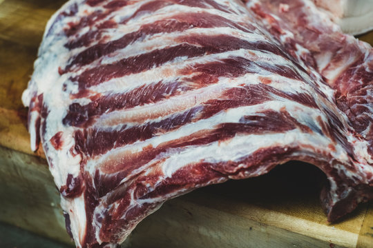 Close up of pork ribs on butcher's block