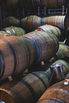 Stack of oak wine barrels in winery