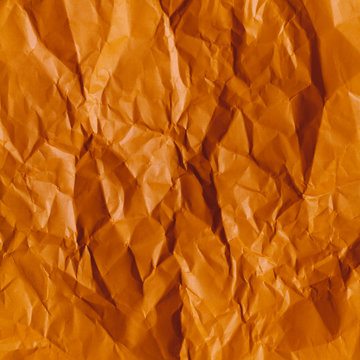 Creased and wrinkled orange paper