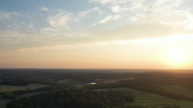 Gorgeous countryside landscape on sunset. Aerial lowering