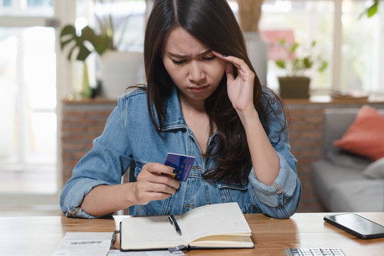 Person calculating expense in house.