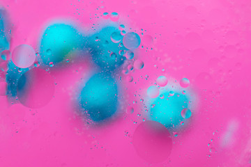 Abstract macro molecular pattern of colored oil bubbles on water. 